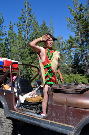 Image of person standing in a Jeep