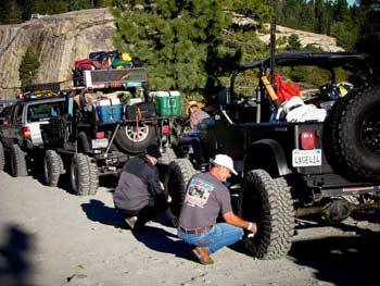 Image of person standing in a Jeep